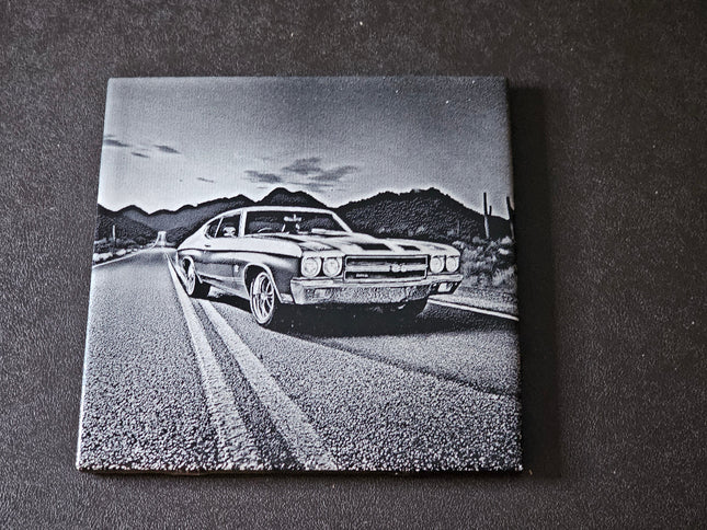  1970 Chevy Chevelle SS on a road with mountains in the background, displayed on a ceramic tile