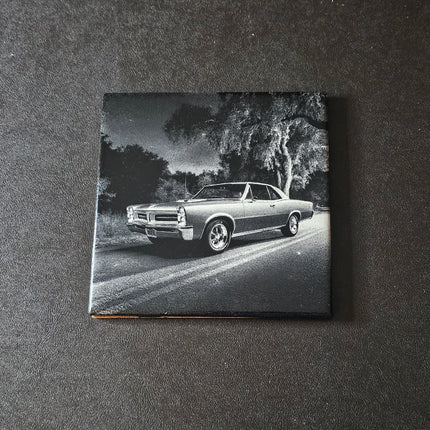 Black and white photo of a classic 65 GTO on a ceramic tile