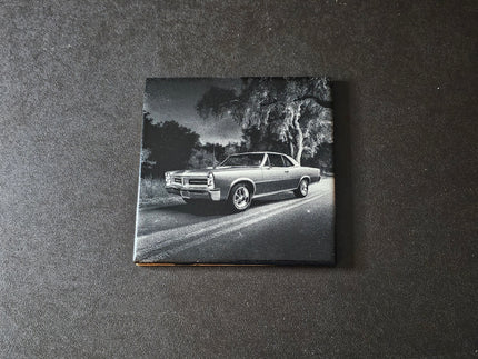 Black and white photo of a classic 65 GTO on a ceramic tile