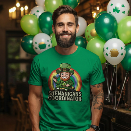Man wearing a green t-shirt with a graphic and text, surrounded by St. Patrick's Day balloons.