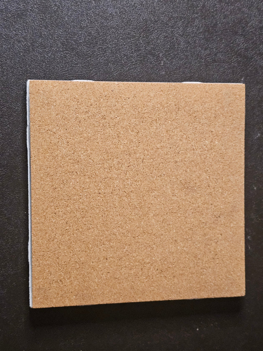 Square piece of cork on the back of a tile